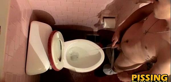  Cute twink flops out his cock and pisses in the toilet bowl
